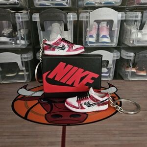 Nike SB pair of mini sneakers keychain.